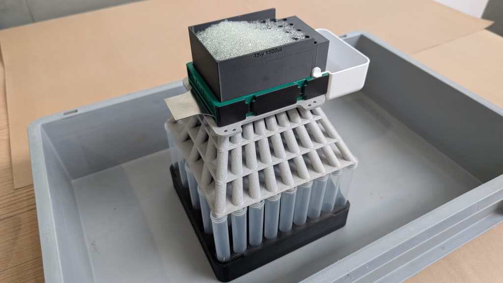 Glass grinding beads filling the 45 well mesh plate of a custom LabTIE dispenser