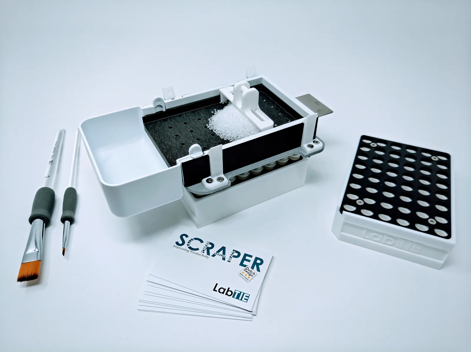 LabTIE 48-tube powder dispenser loading powder into auto-decapping pharma vials