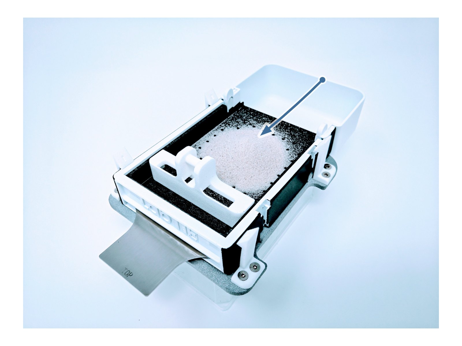 Step 1: filling a LabTIE powder dispenser with powder above the mesh plate